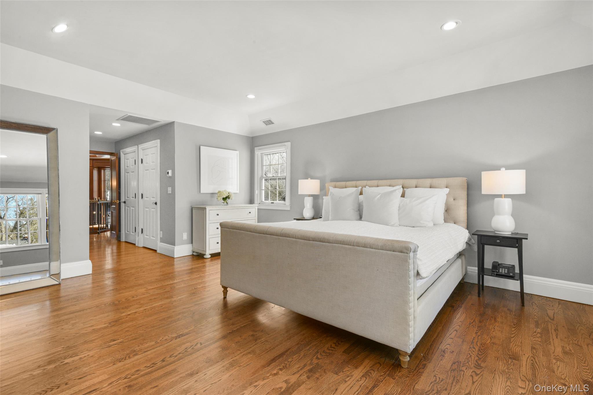 10 Hilltop Road Larchmont, NY 10538 - Photo 25 of 50 Another view of the primary bedroom, featuring two walk-in closets and French doors to the library/office.
