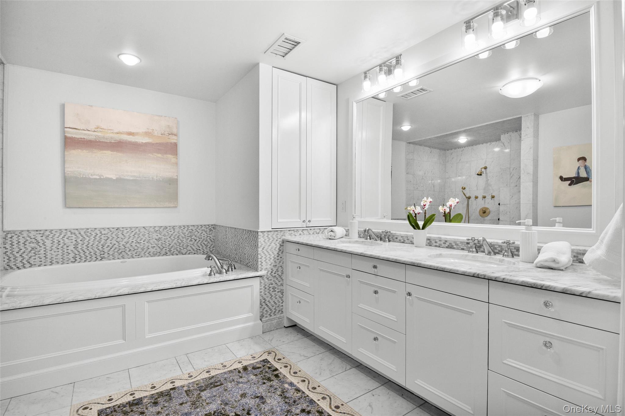 10 Hilltop Road Larchmont, NY 10538 - Photo 26 of 50 Primary Bathroom with double vanity, large tub, and separate shower.