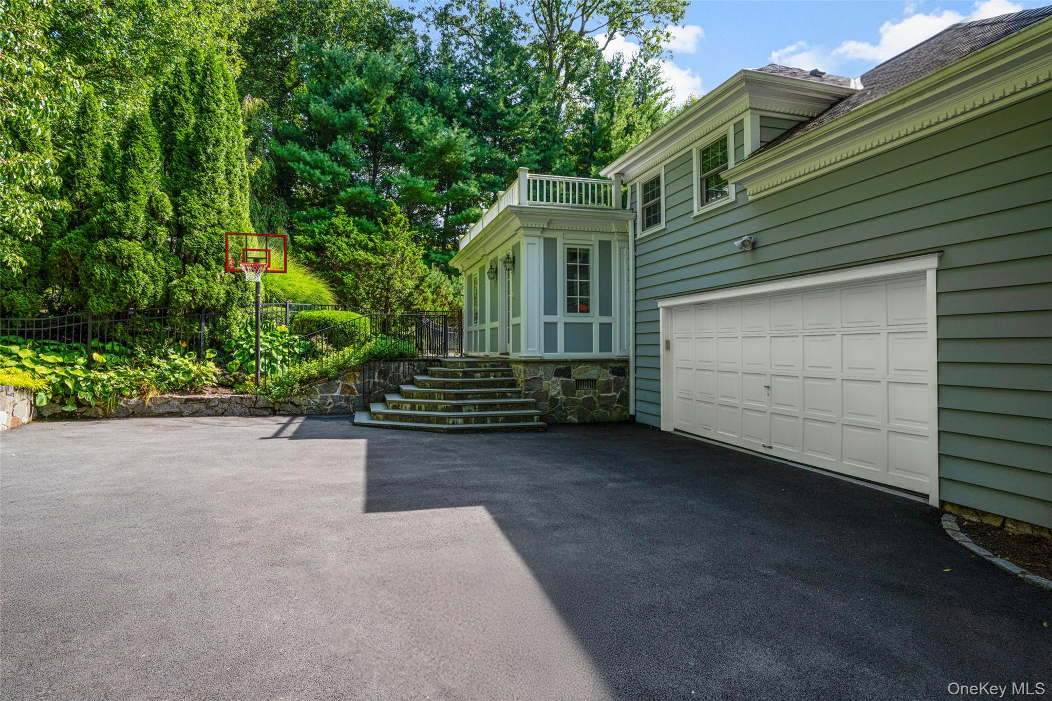 10 Hilltop Road Larchmont, NY 10538 - Photo 41 of 50 Driveway leading into a large two-car garage and access to the mudroom and yard.