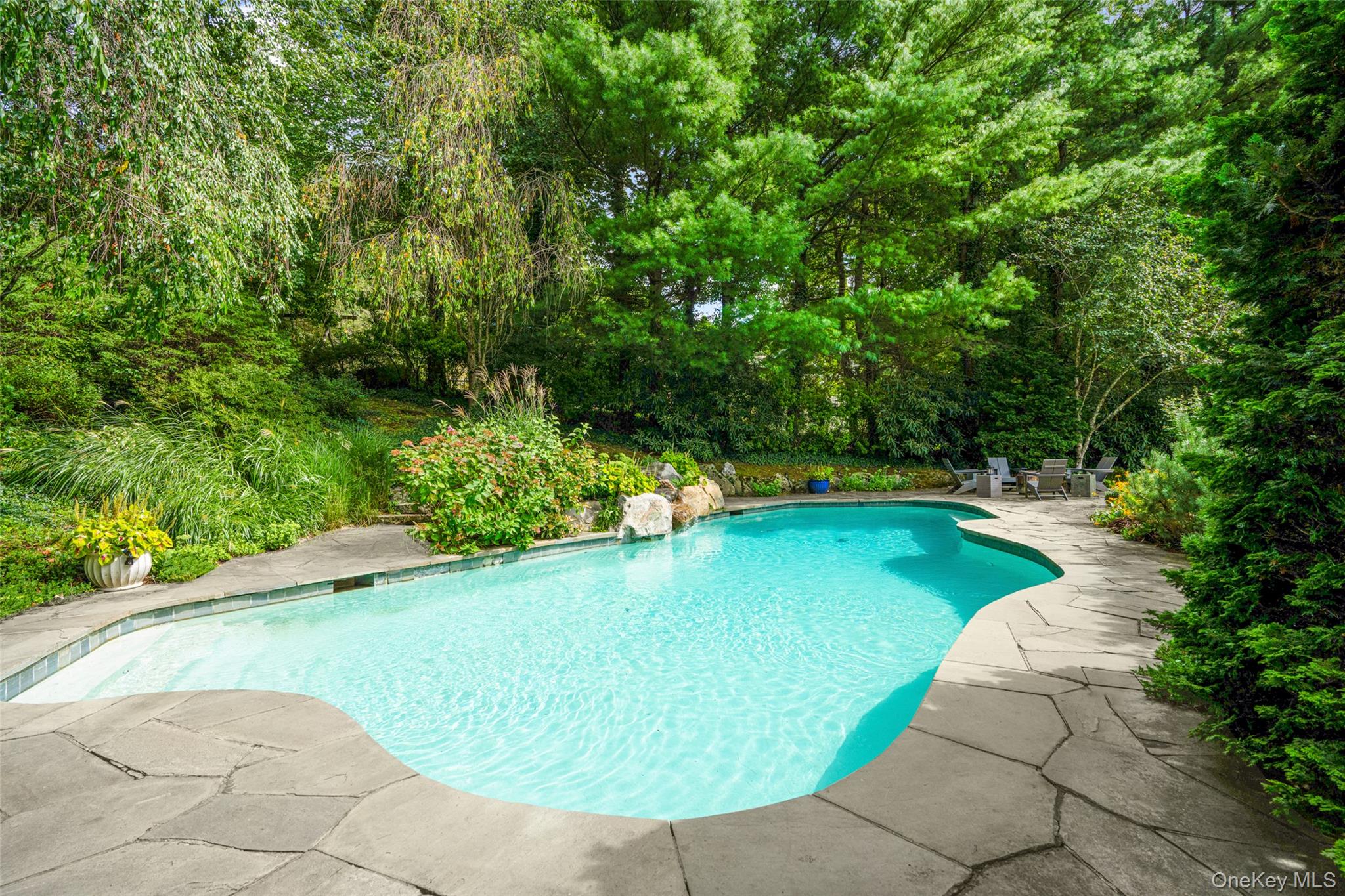 10 Hilltop Road Larchmont, NY 10538 - Photo 43 of 50 Pool with a waterfall feature.