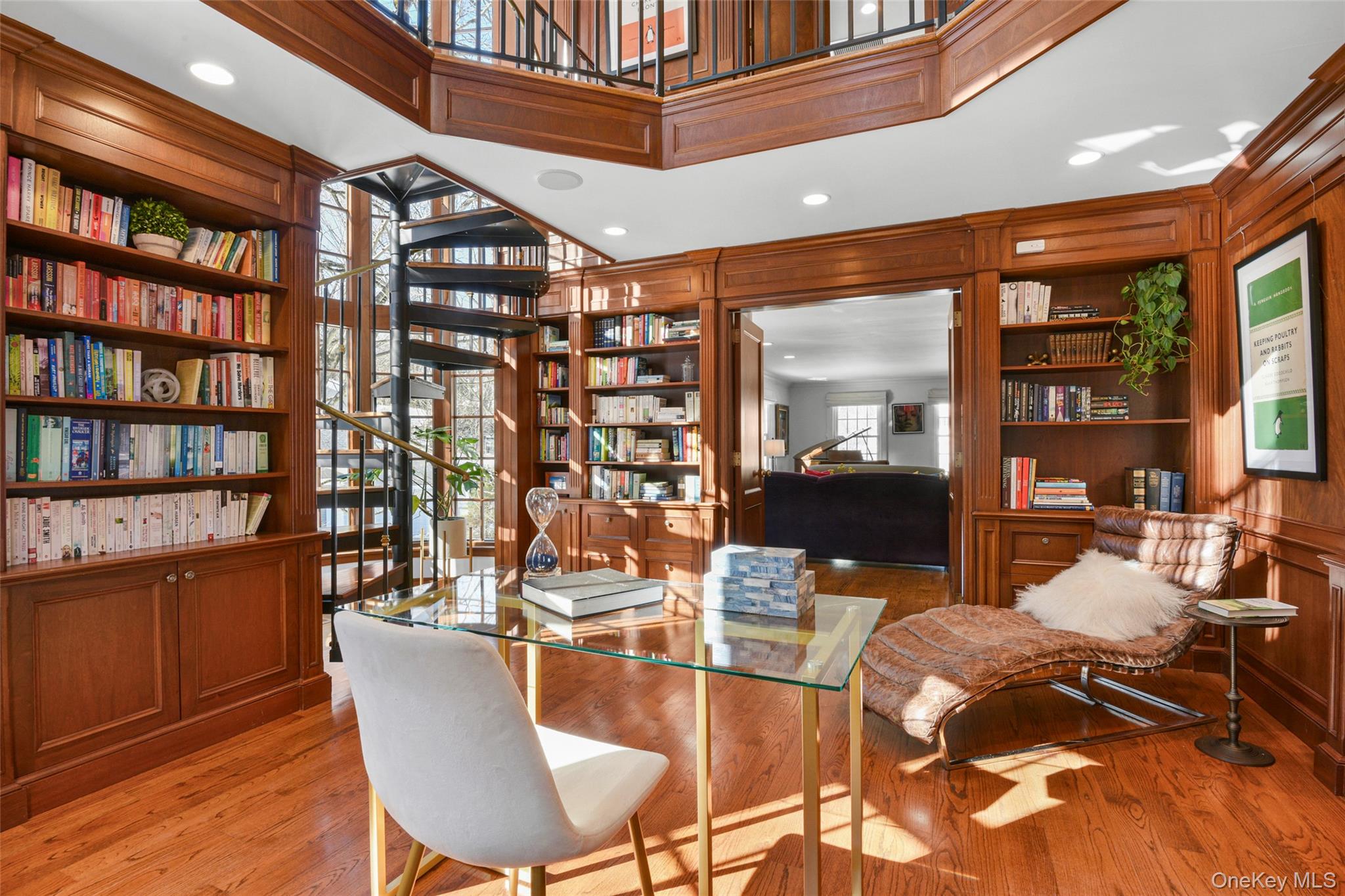 10 Hilltop Road Larchmont, NY 10538 - Photo 8 of 50 Two-story library featuring a spiral staircase to the second level and French doors opening to the living room.