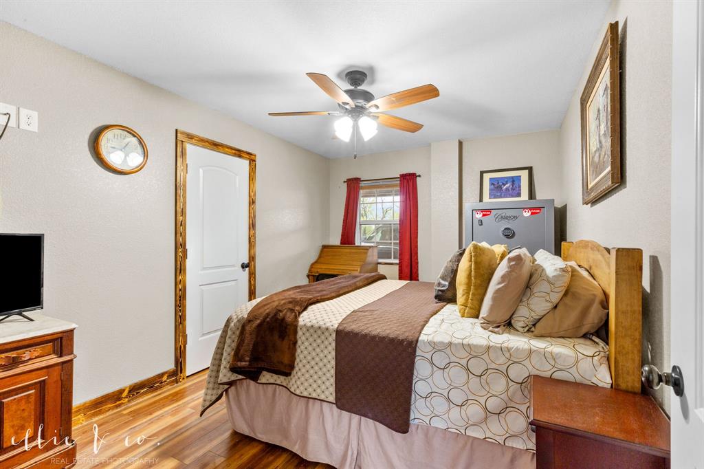 342 County Road 644 Merkel, TX 79536 - Photo 12 of 36 a bedroom with a bed and a flat screen tv