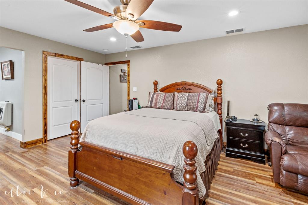342 County Road 644 Merkel, TX 79536 - Photo 15 of 36 a bedroom with furniture and wooden floor