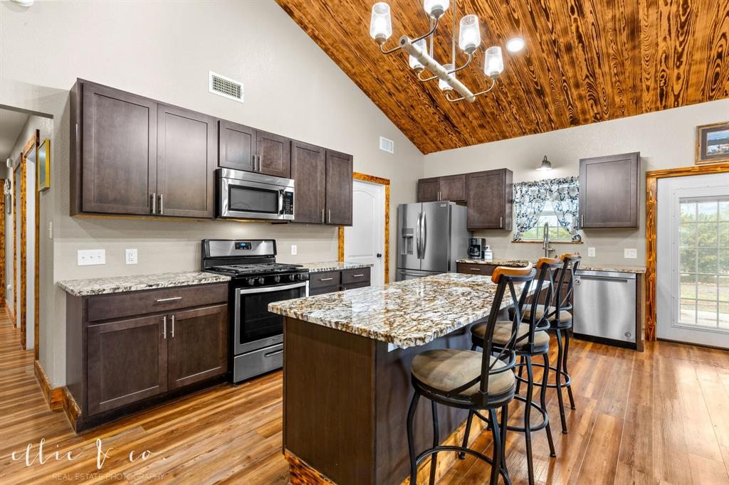 342 County Road 644 Merkel, TX 79536 - Photo 6 of 36 a kitchen with stainless steel appliances granite countertop a stove refrigerator sink and cabinets