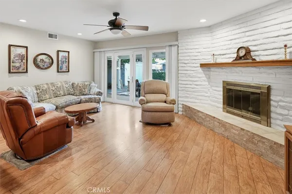 a living room with furniture and a fireplace