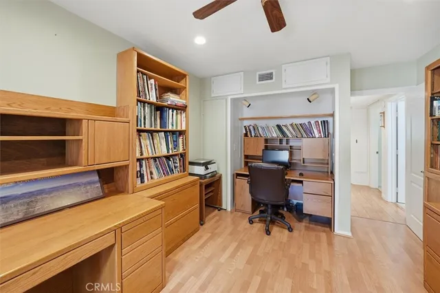 a reading room with furniture and a book shelf