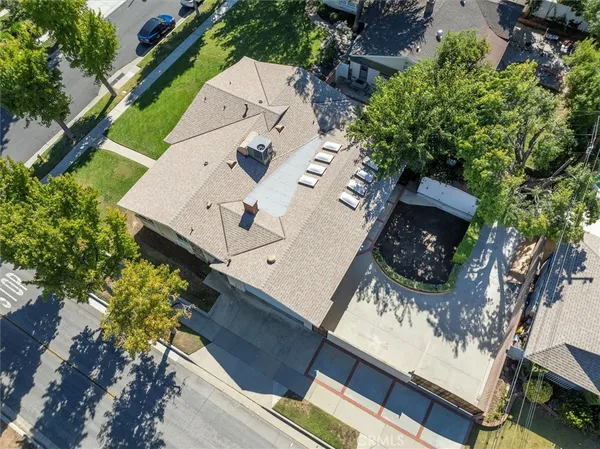 an aerial view of house with yard