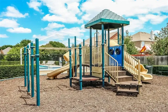 a view of a deck with a table and chairs