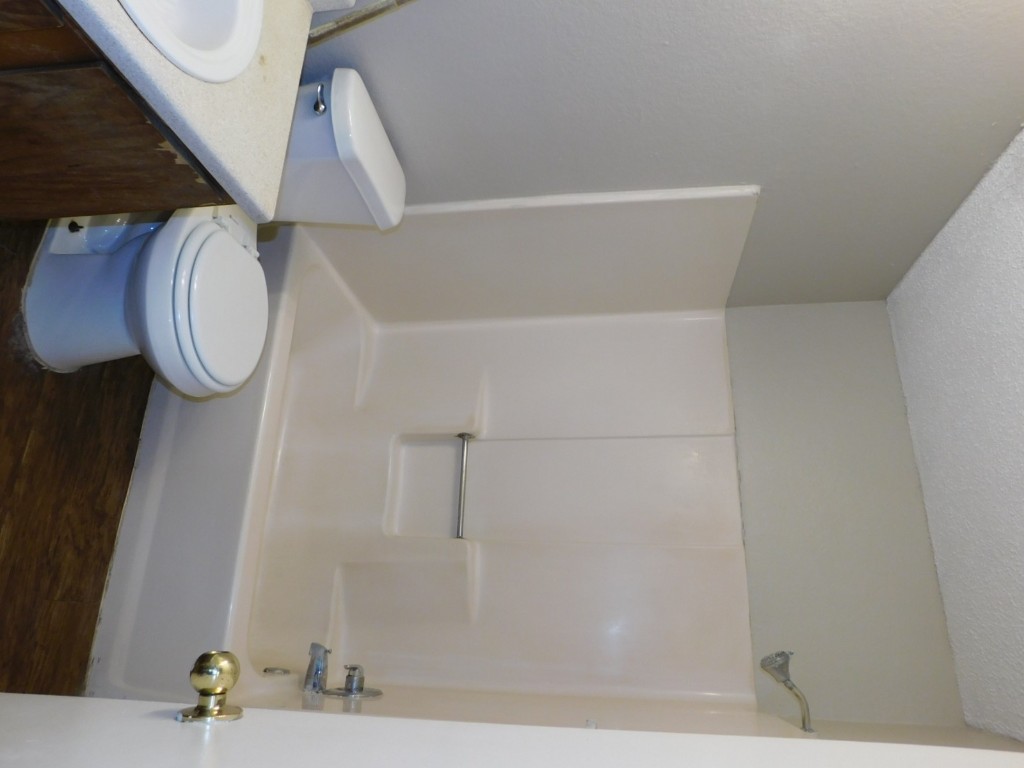 2223 Katy Lane, Unit B Georgetown, TX 78626 - Photo 11 of 11 a bathroom with a toilet a sink and a bathtub