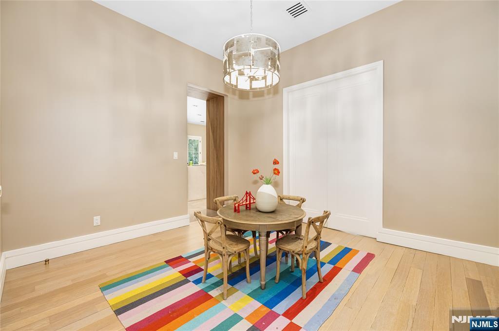 241 East Saddle River Road Saddle River, NJ 07458 - Photo 14 of 48 a view of a dining room with furniture and chandelier