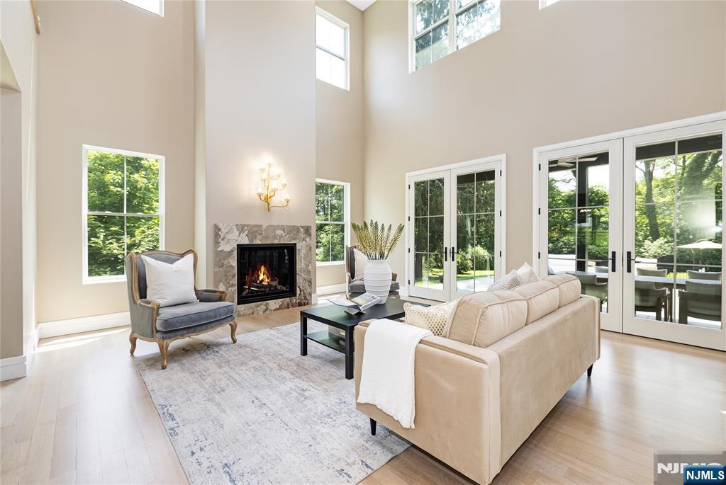 241 East Saddle River Road Saddle River, NJ 07458 - Photo 3 of 48 a living room with furniture and a fireplace