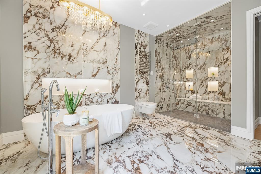 241 East Saddle River Road Saddle River, NJ 07458 - Photo 33 of 48 a living room with a couch and a table