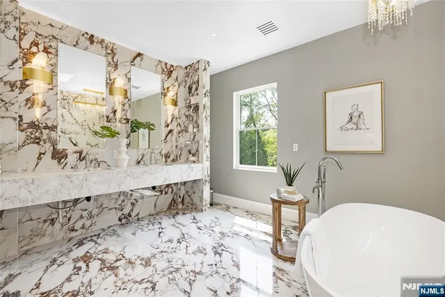 a bathroom with a bathtub and shower