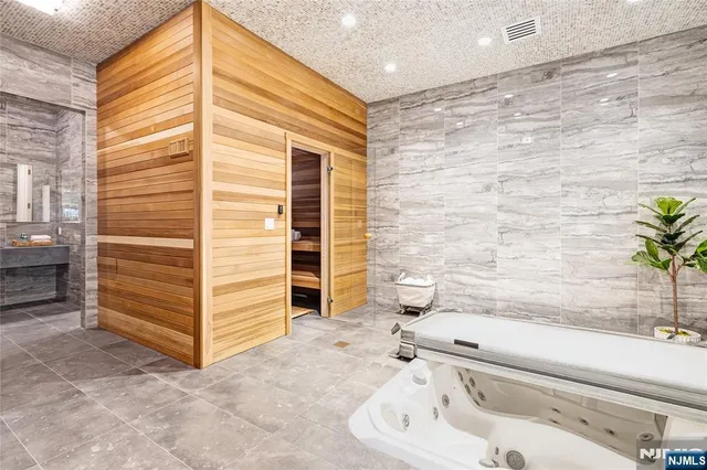 a bathroom with a bathtub and a sink