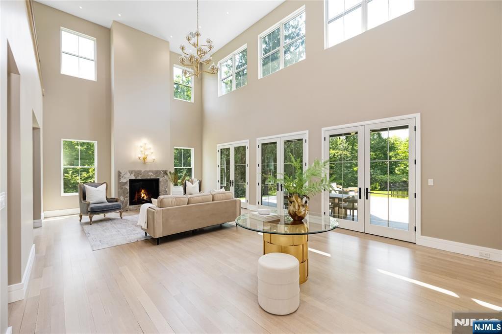 241 East Saddle River Road Saddle River, NJ 07458 - Photo 4 of 48 a living room with fireplace furniture and a large window