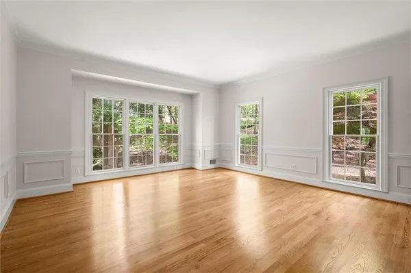 a kitchen with stainless steel appliances granite countertop a refrigerator a stove and a sink