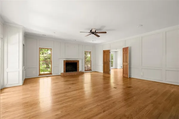 a kitchen with stainless steel appliances kitchen island granite countertop a stove and a microwave