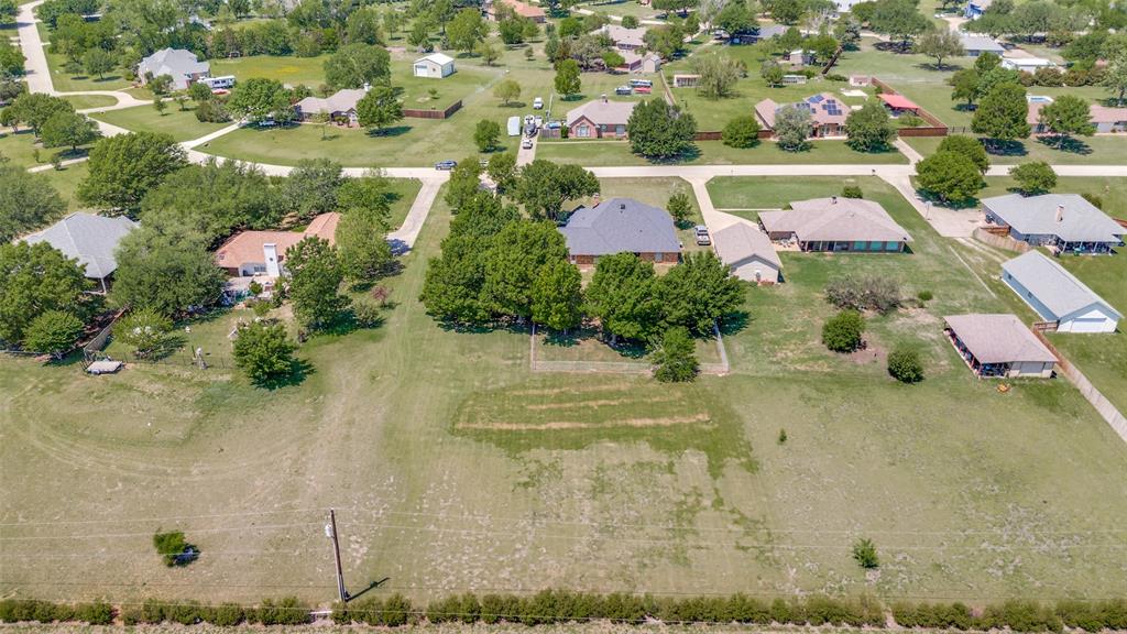 an aerial view of residential house with outdoor space
