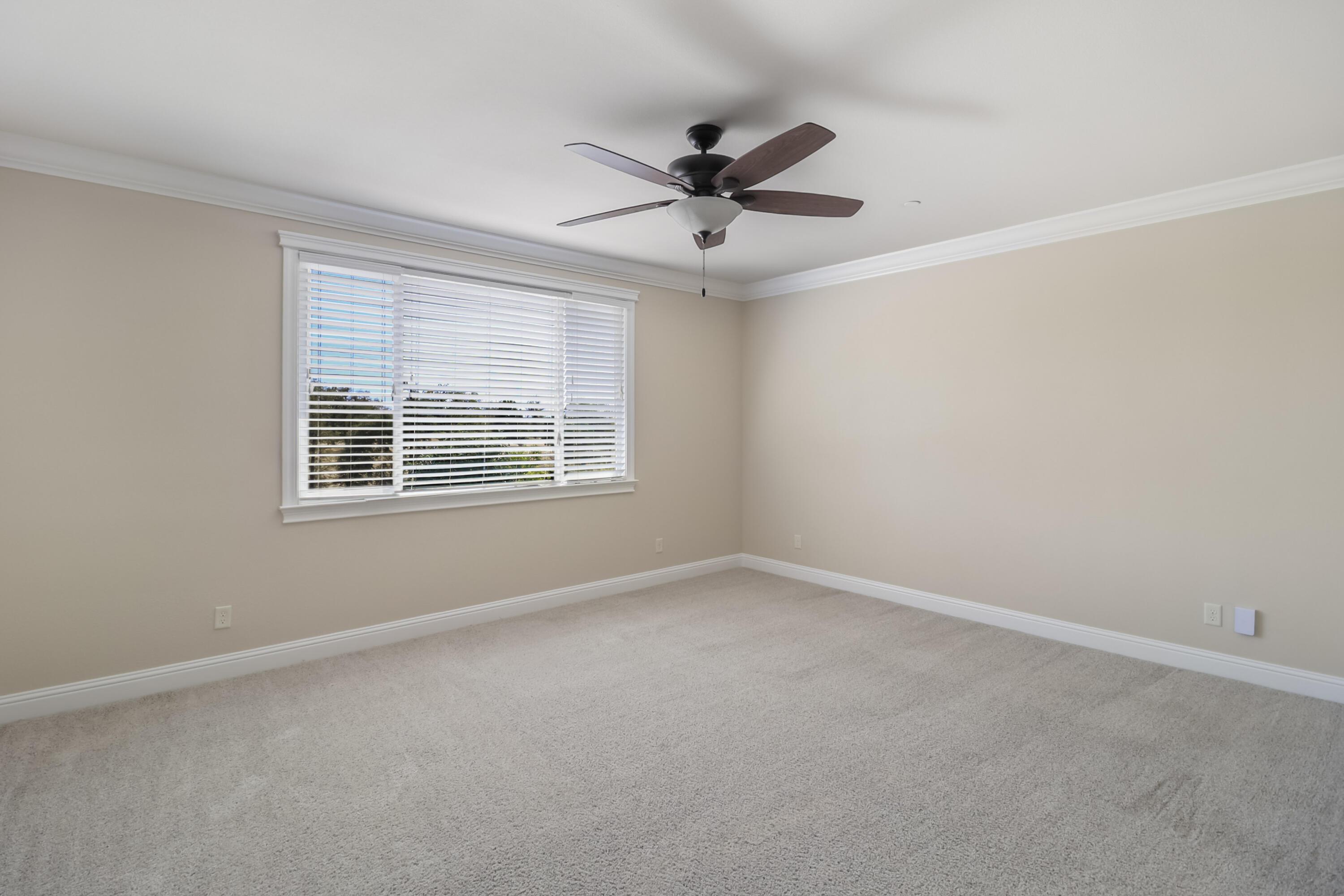 3863 Indian Wells Lane Redding, CA 96002 - Photo 29 of 63 an empty room with ceiling fan and windows