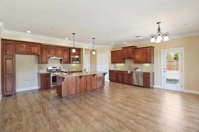 a large kitchen with lots of counter space and appliances