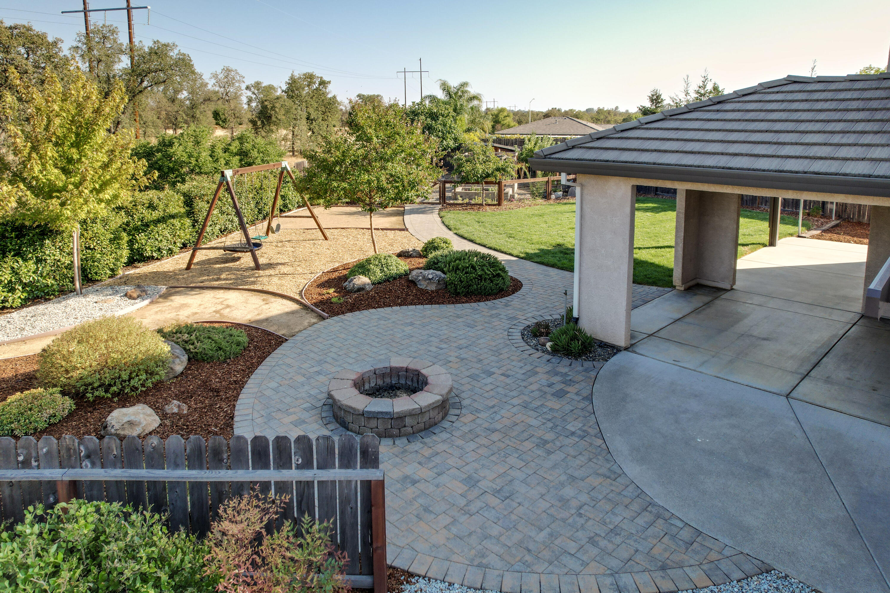 3863 Indian Wells Lane Redding, CA 96002 - Photo 37 of 63 a view of a house with wooden fence