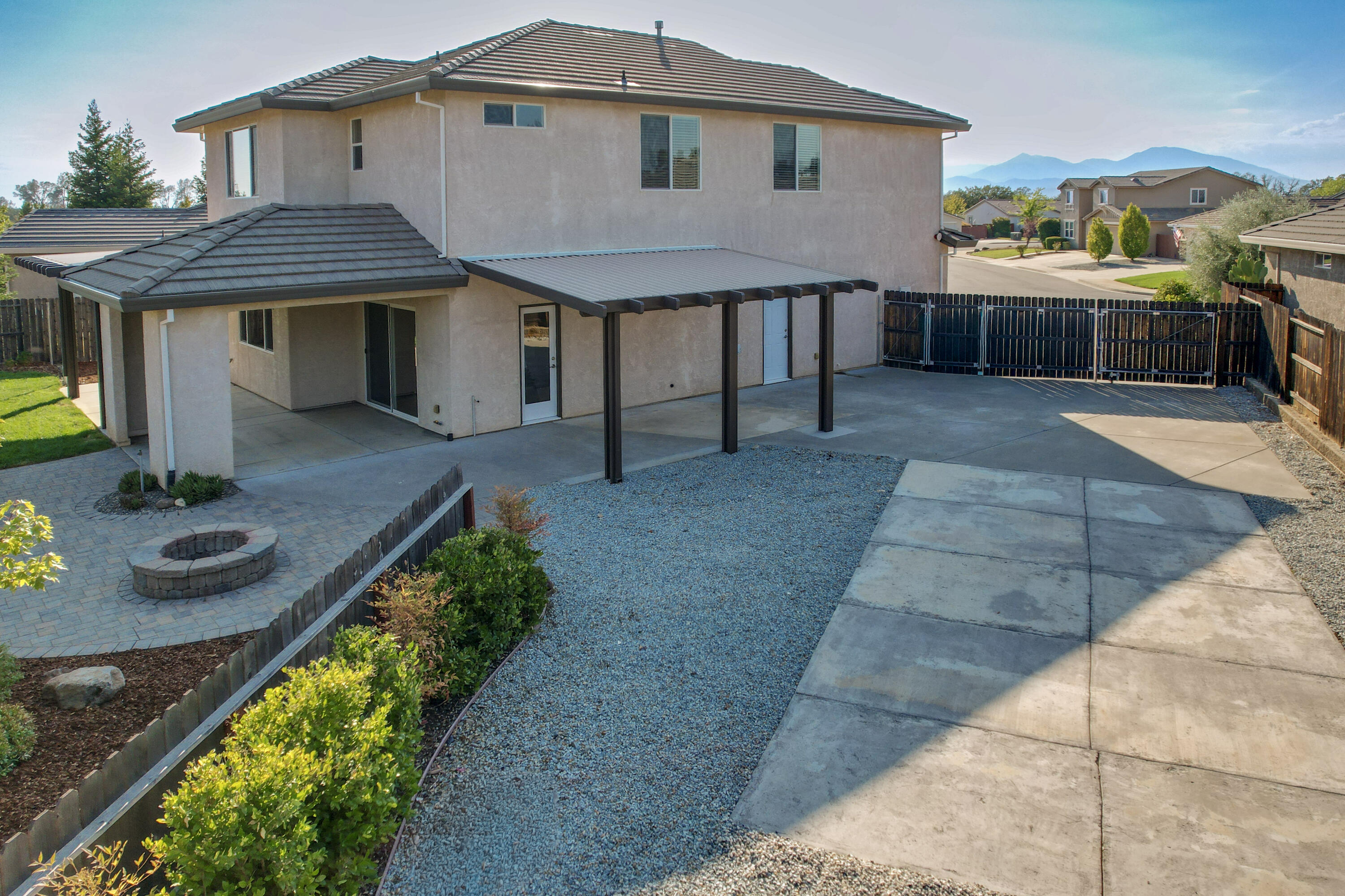 3863 Indian Wells Lane Redding, CA 96002 - Photo 38 of 63 a front view of a house with garden