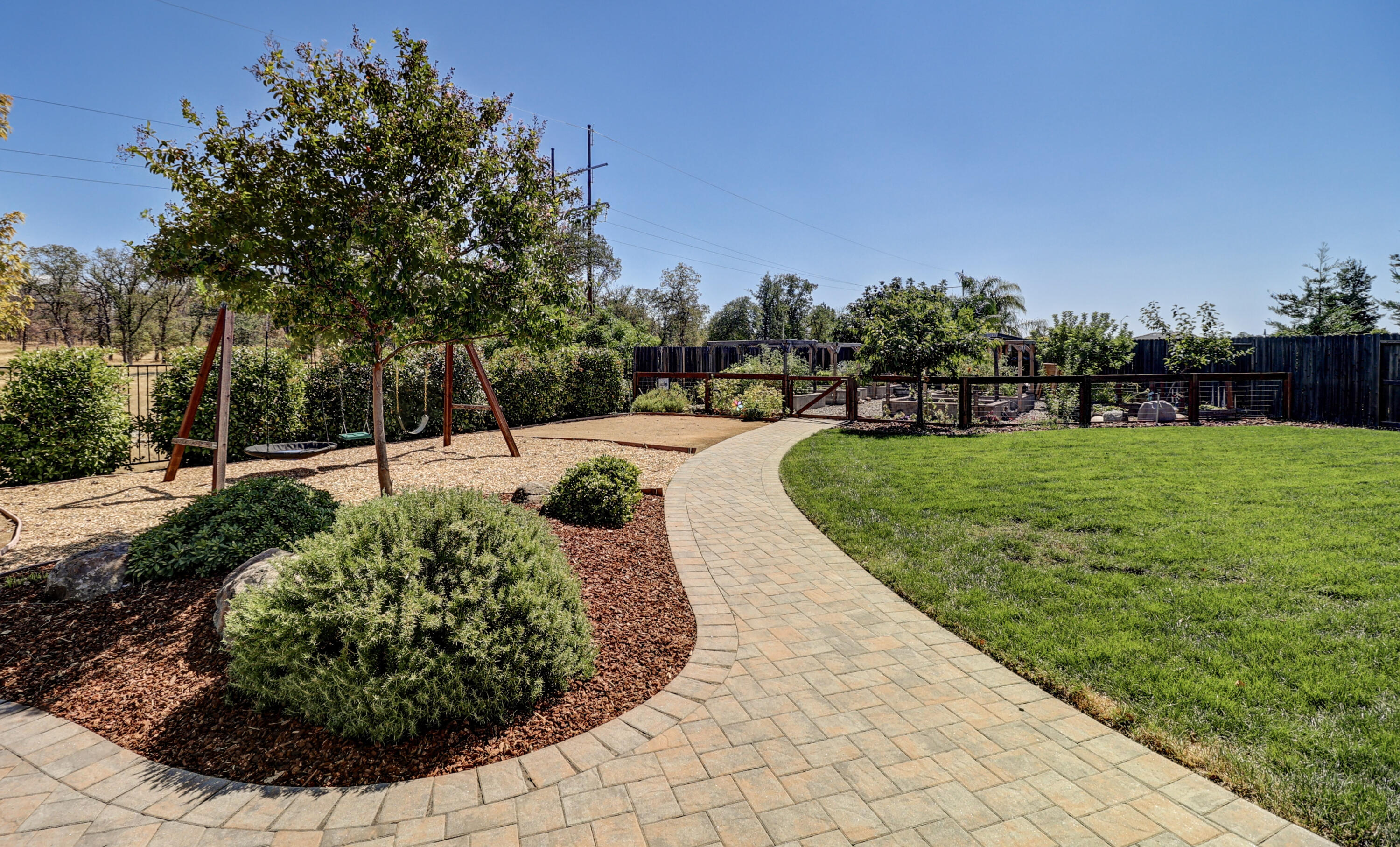 3863 Indian Wells Lane Redding, CA 96002 - Photo 47 of 63 a view of a backyard with sitting area
