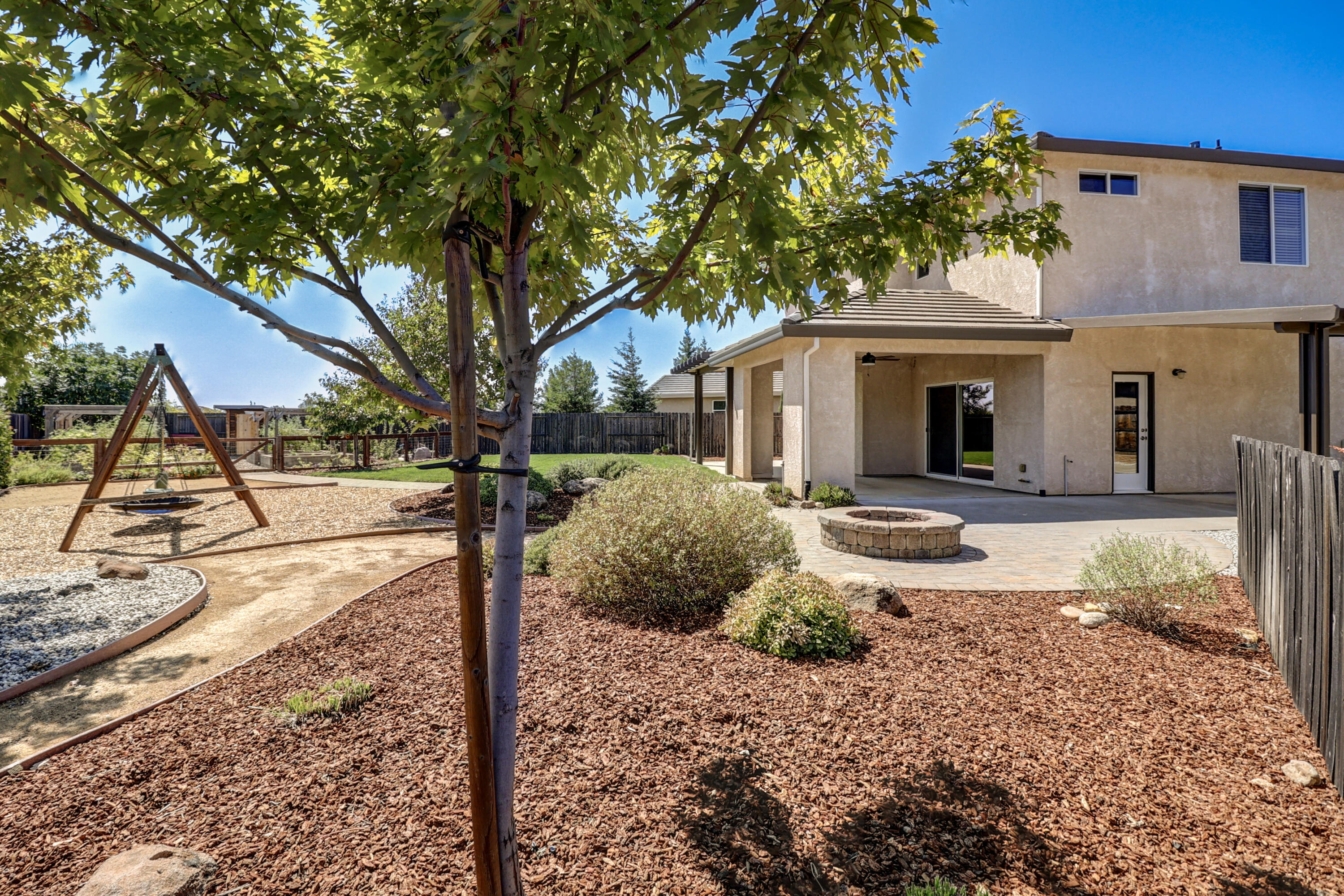3863 Indian Wells Lane Redding, CA 96002 - Photo 50 of 63 a front view of a house with garden