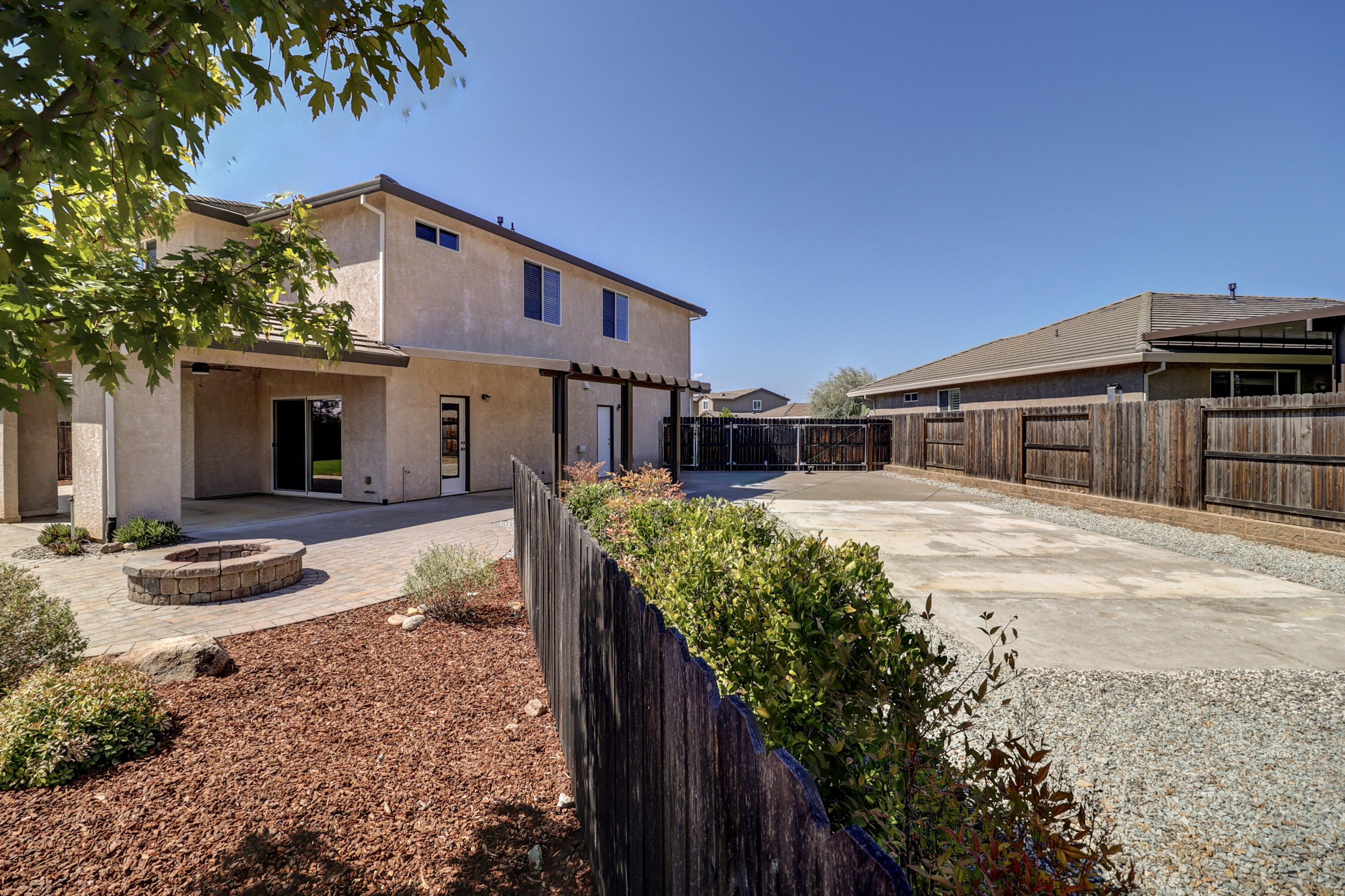 3863 Indian Wells Lane Redding, CA 96002 - Photo 53 of 63 a front view of a house with garden