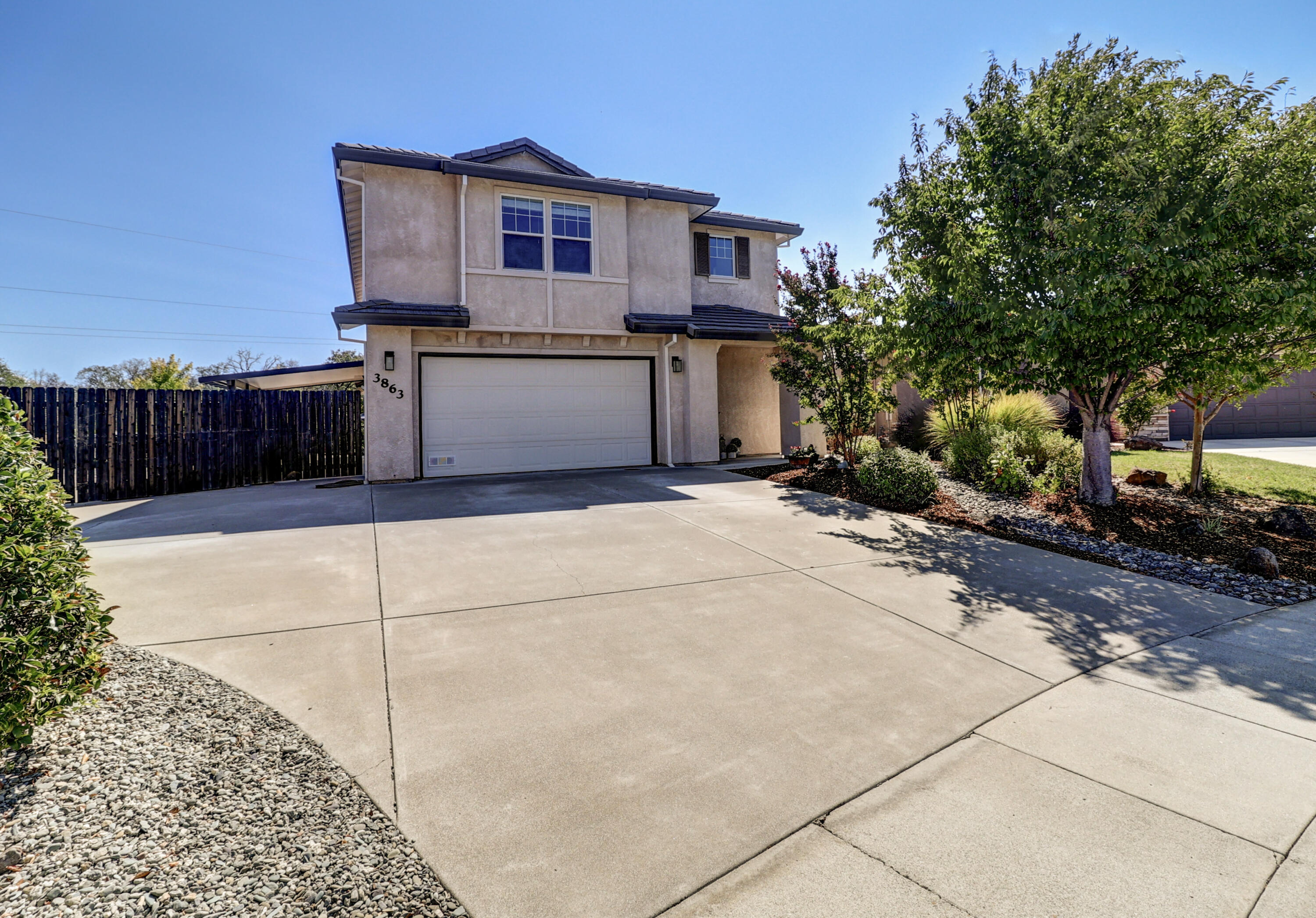 3863 Indian Wells Lane Redding, CA 96002 - Photo 58 of 63 a view of a house with a garage