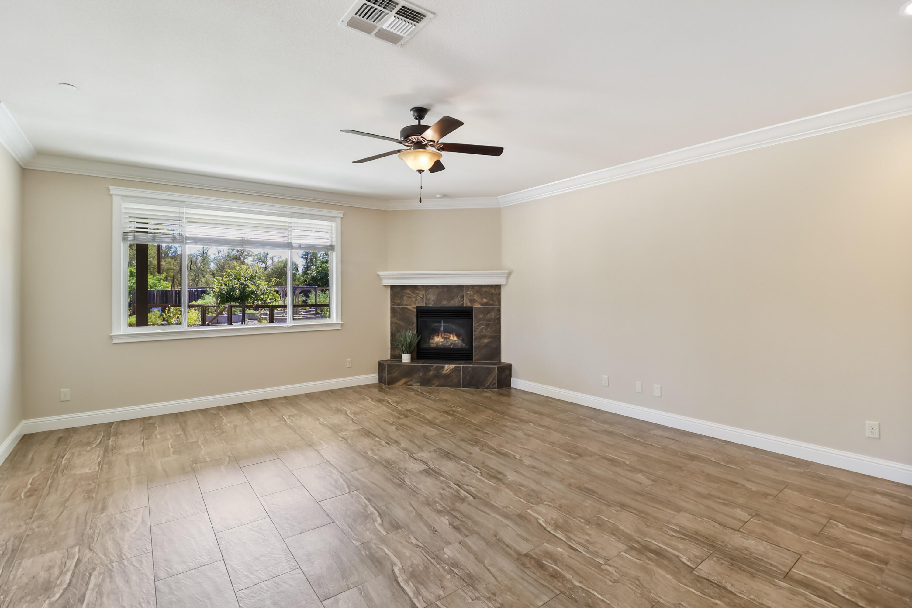 3863 Indian Wells Lane Redding, CA 96002 - Photo 7 of 63 wooden floor in an empty room with a window