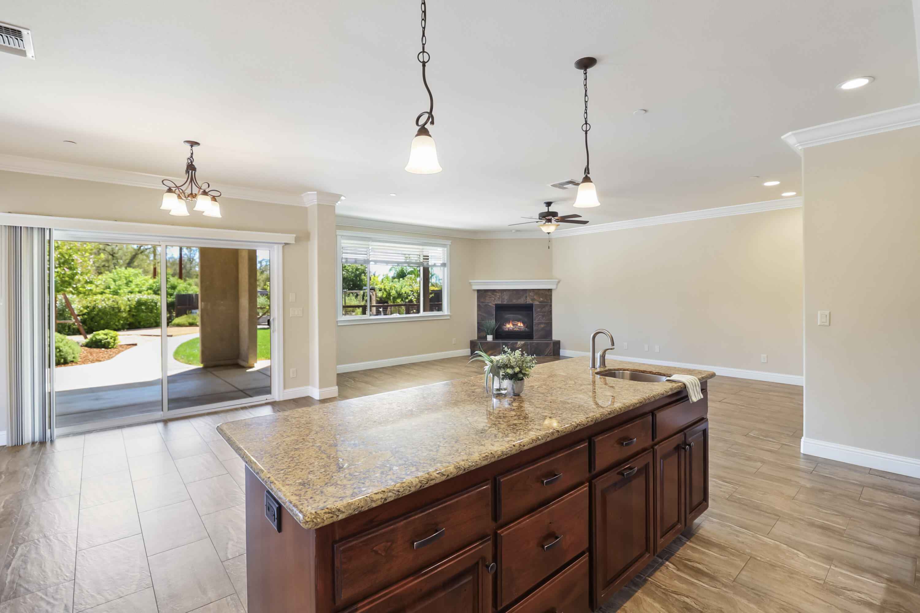 3863 Indian Wells Lane Redding, CA 96002 - Photo 10 of 63 a kitchen with sink refrigerator and window