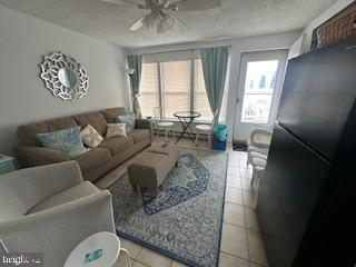 413 East Brigantine Avenue, Unit 29 Brigantine, NJ 08203 - Photo 1 of 10 a living room with furniture and a large window