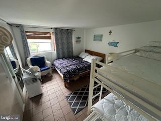 413 East Brigantine Avenue, Unit 29 Brigantine, NJ 08203 - Photo 6 of 10 a bedroom with a bed and a window
