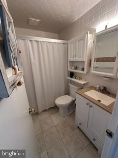 413 East Brigantine Avenue, Unit 29 Brigantine, NJ 08203 - Photo 7 of 10 a room with a stove a washer and dryer