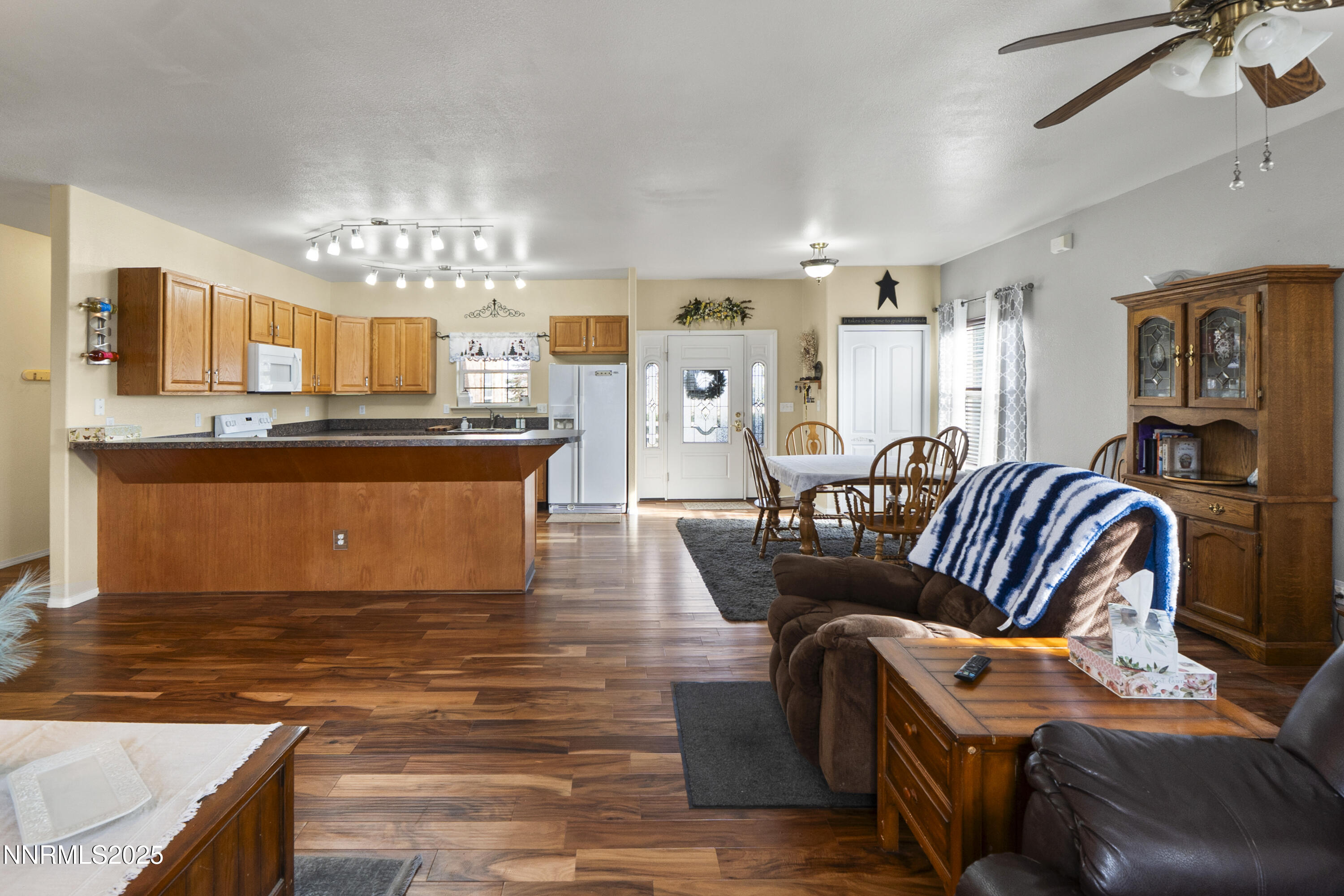 6990 Airport Road Winnemucca, NV 89445 - Photo 14 of 47 a living room with furniture and a chandelier