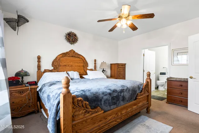 a bedroom with a bed and dresser