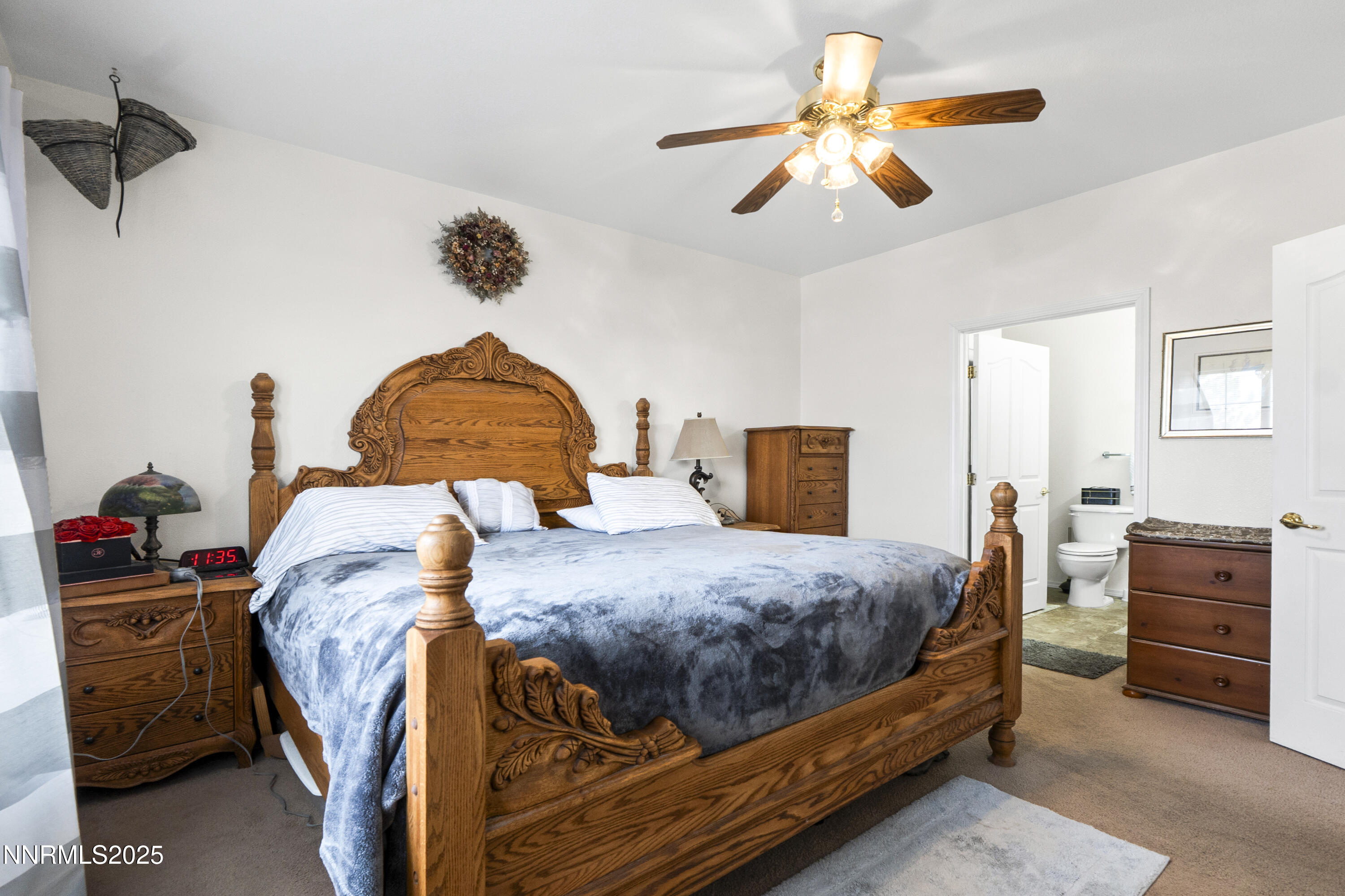 6990 Airport Road Winnemucca, NV 89445 - Photo 18 of 47 a bedroom with a bed and dresser