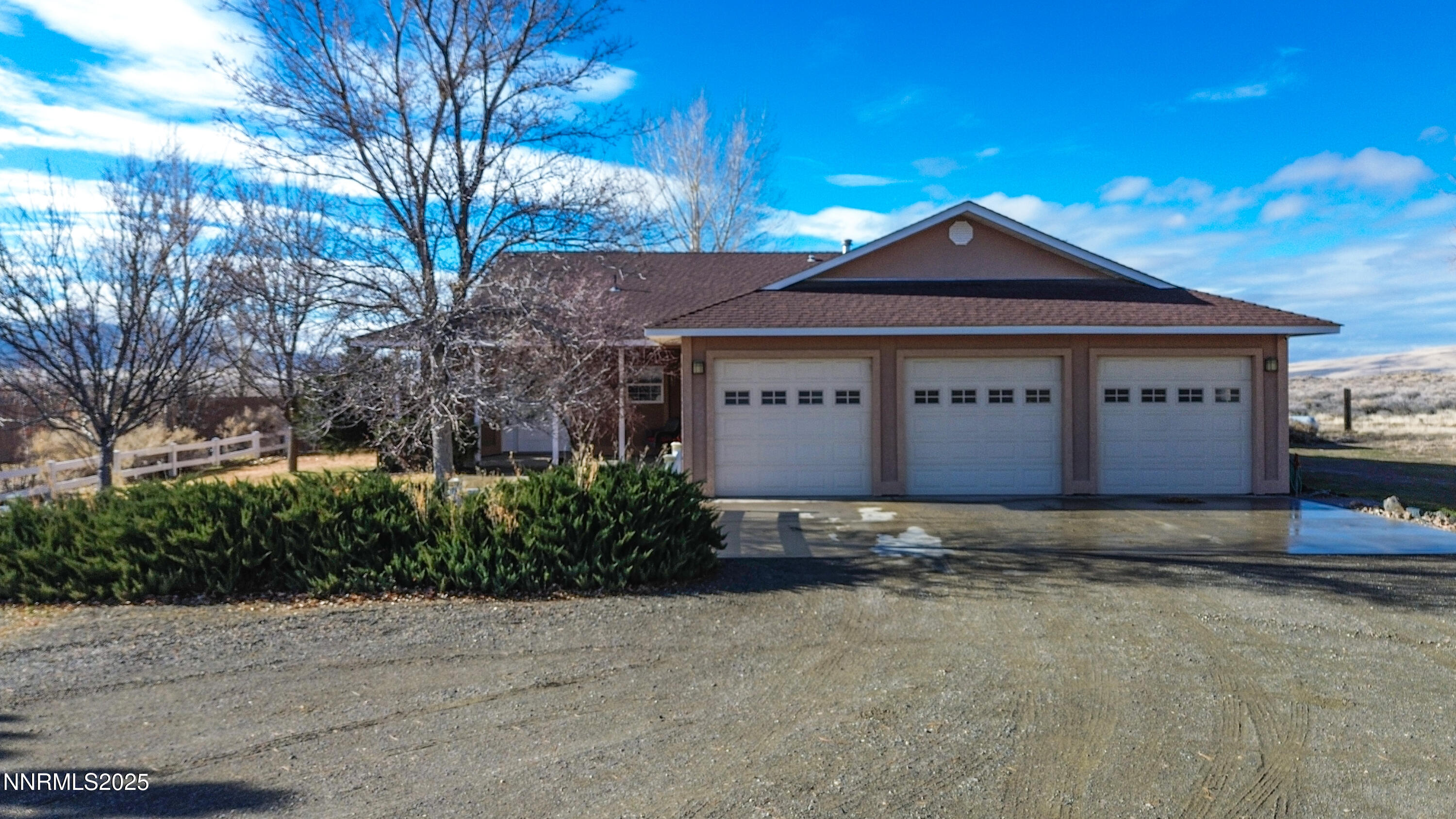 6990 Airport Road Winnemucca, NV 89445 - Photo 2 of 47 a front view of a house with a yard