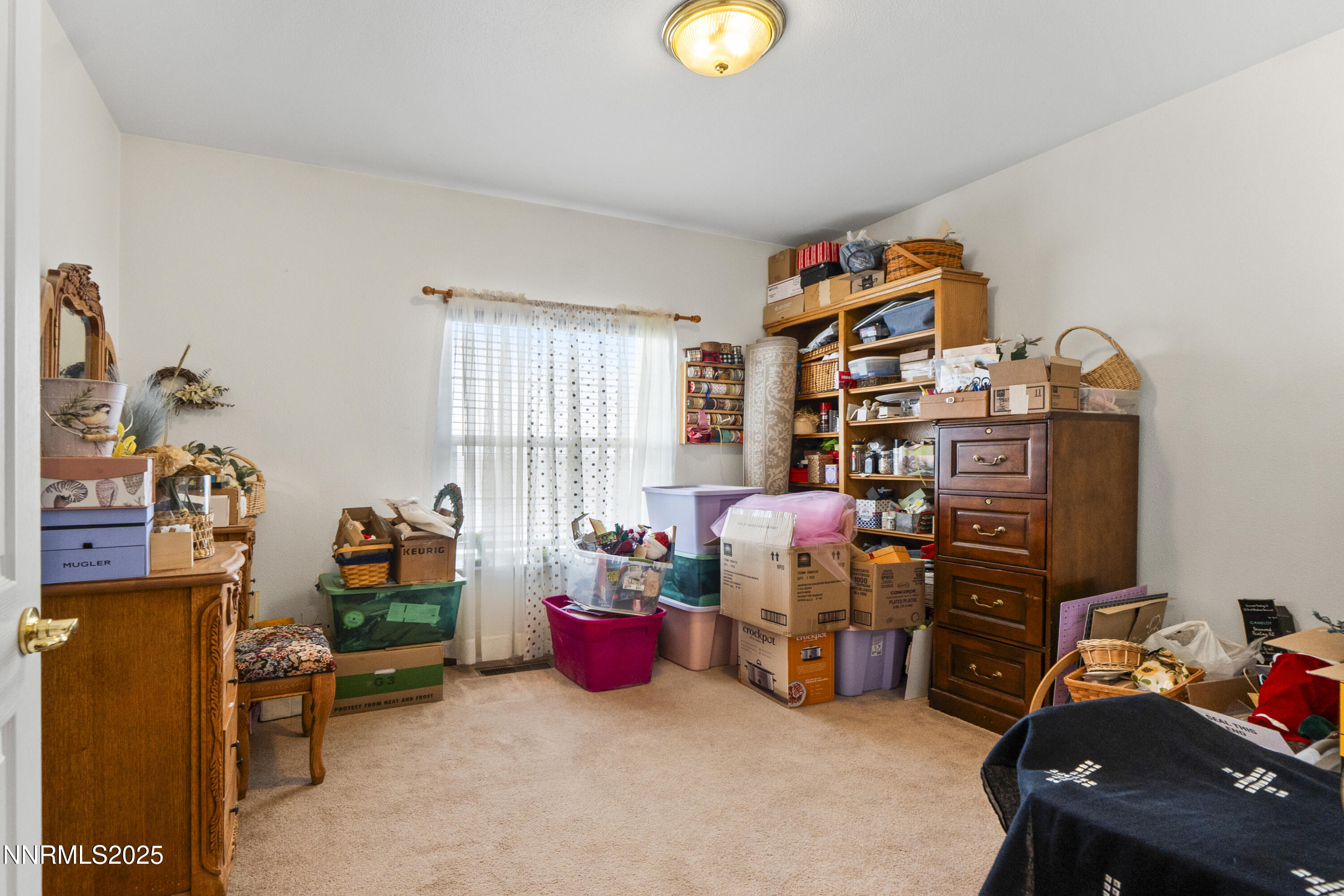 6990 Airport Road Winnemucca, NV 89445 - Photo 24 of 47 a living room with furniture and a flat screen tv