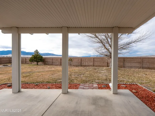 a view of a porch with a floor to ceiling window