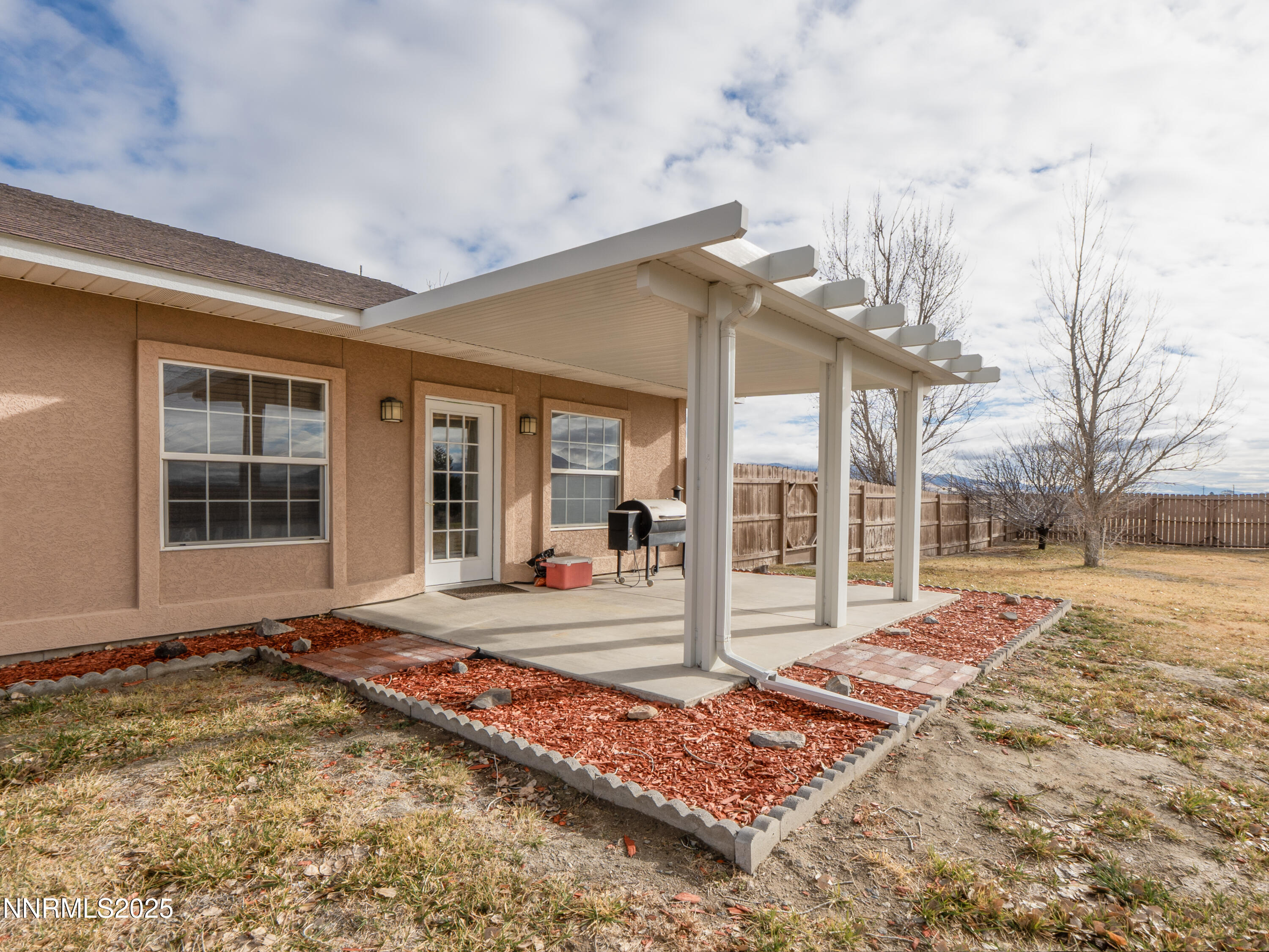 6990 Airport Road Winnemucca, NV 89445 - Photo 34 of 47 a house with trees in front of it