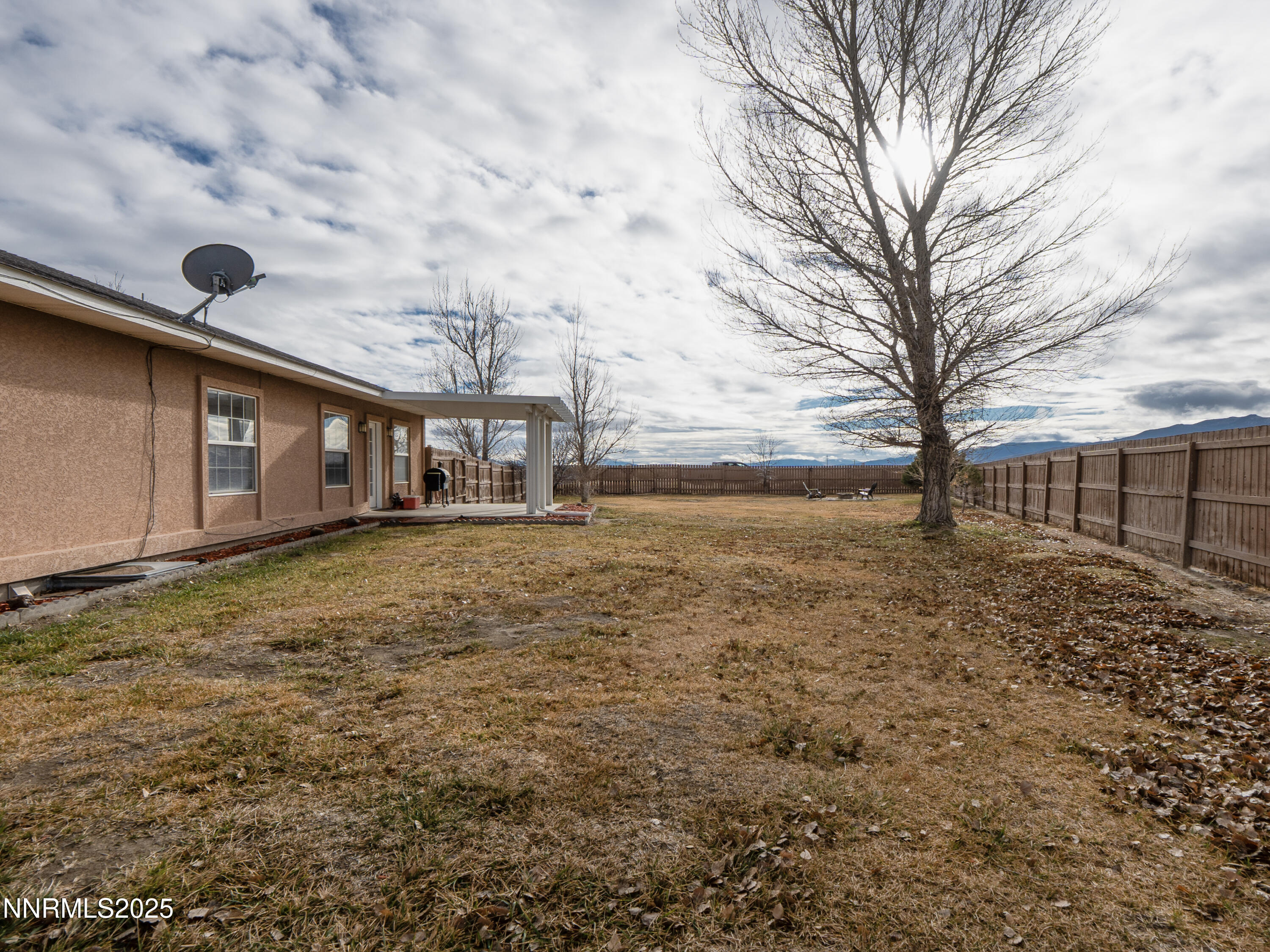 6990 Airport Road Winnemucca, NV 89445 - Photo 36 of 47 a front view of house with yard and ocean view