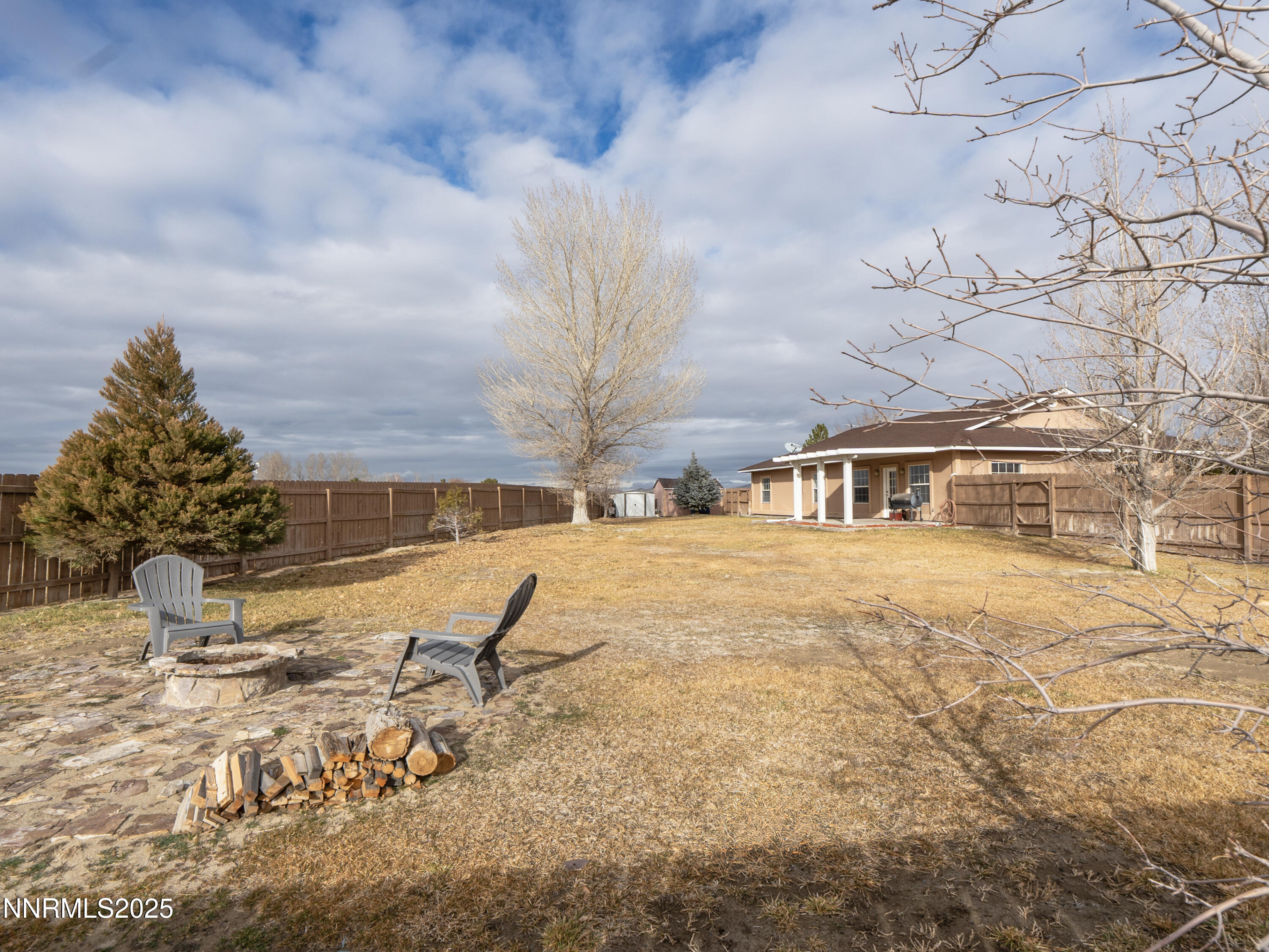 6990 Airport Road Winnemucca, NV 89445 - Photo 38 of 47 a street view with large trees