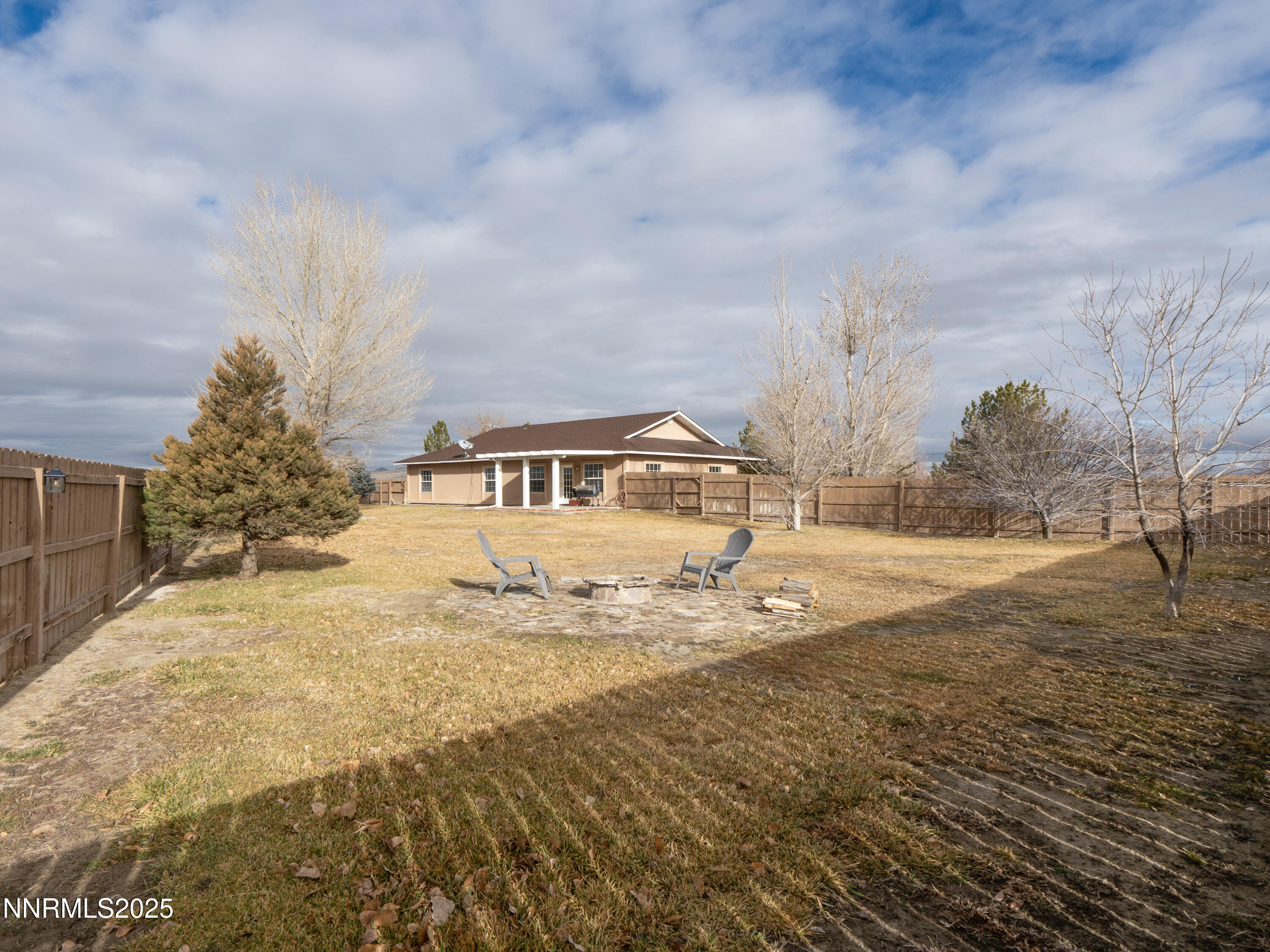 6990 Airport Road Winnemucca, NV 89445 - Photo 40 of 47 a view of dirt yard with large trees