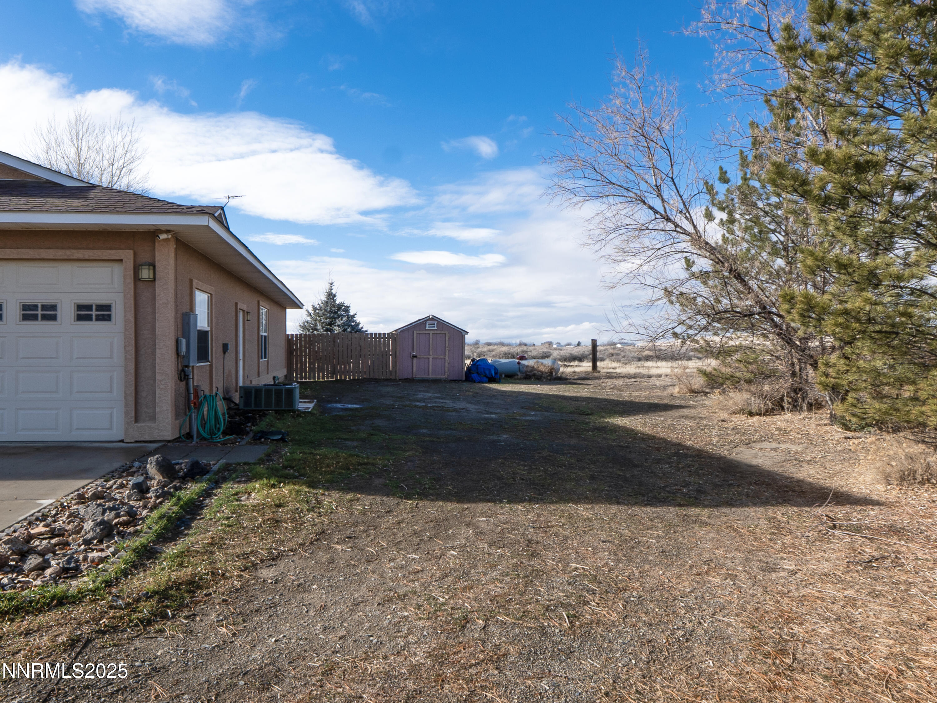 6990 Airport Road Winnemucca, NV 89445 - Photo 41 of 47 a view of a house with a yard
