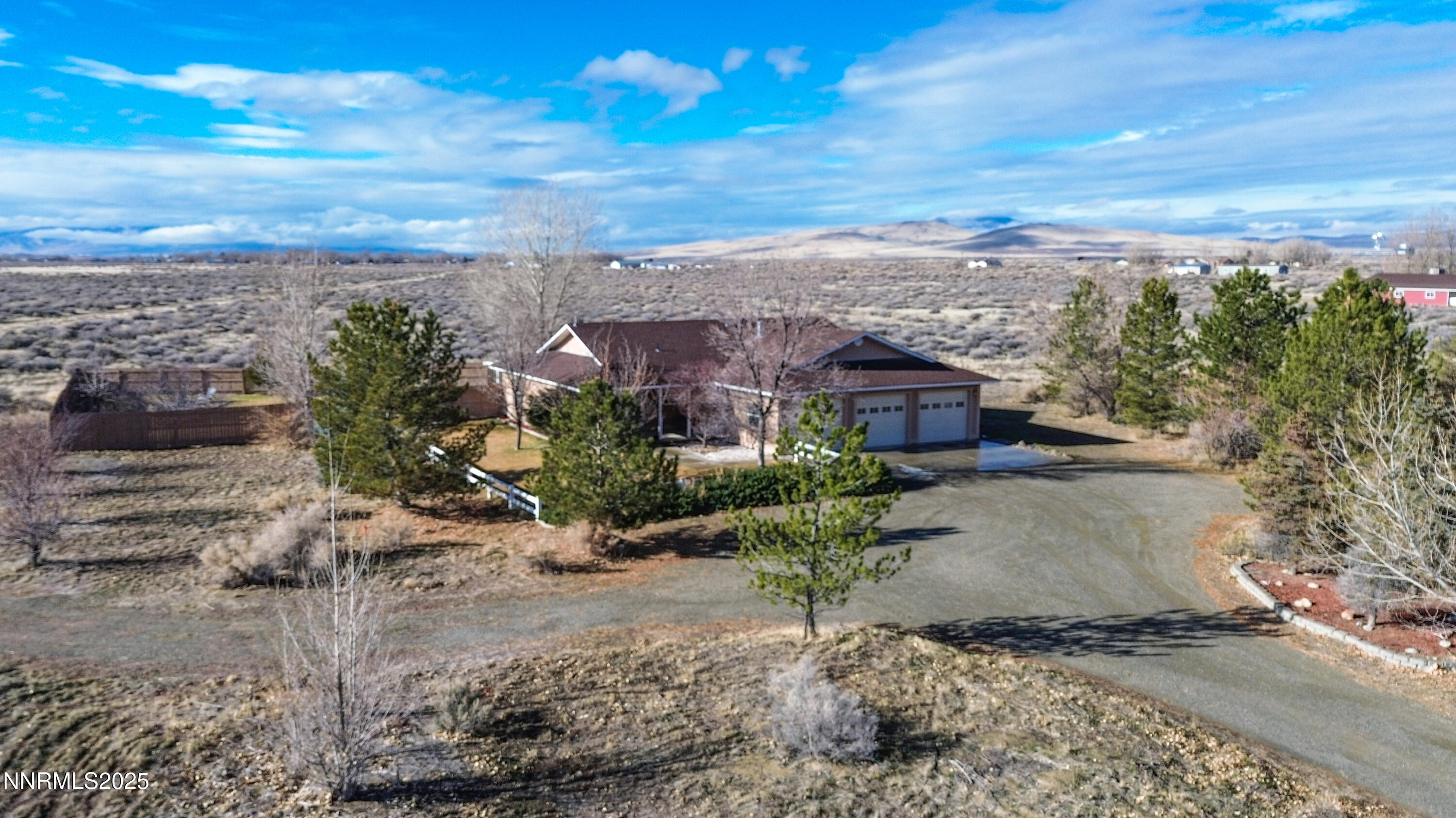 6990 Airport Road Winnemucca, NV 89445 - Photo 45 of 47 a view of a yard and front view of a house