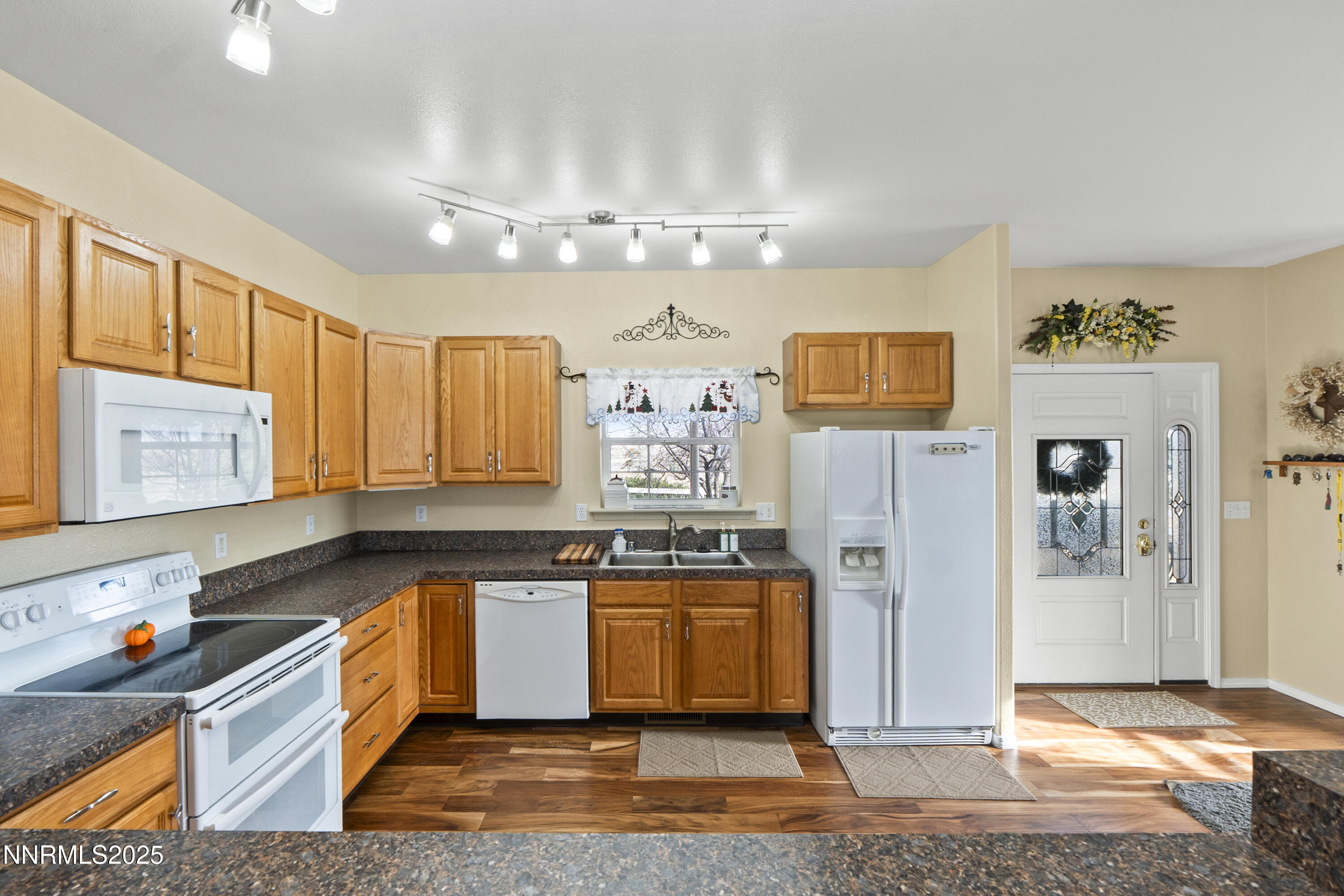 6990 Airport Road Winnemucca, NV 89445 - Photo 10 of 47 a kitchen with stainless steel appliances granite countertop a sink and cabinets