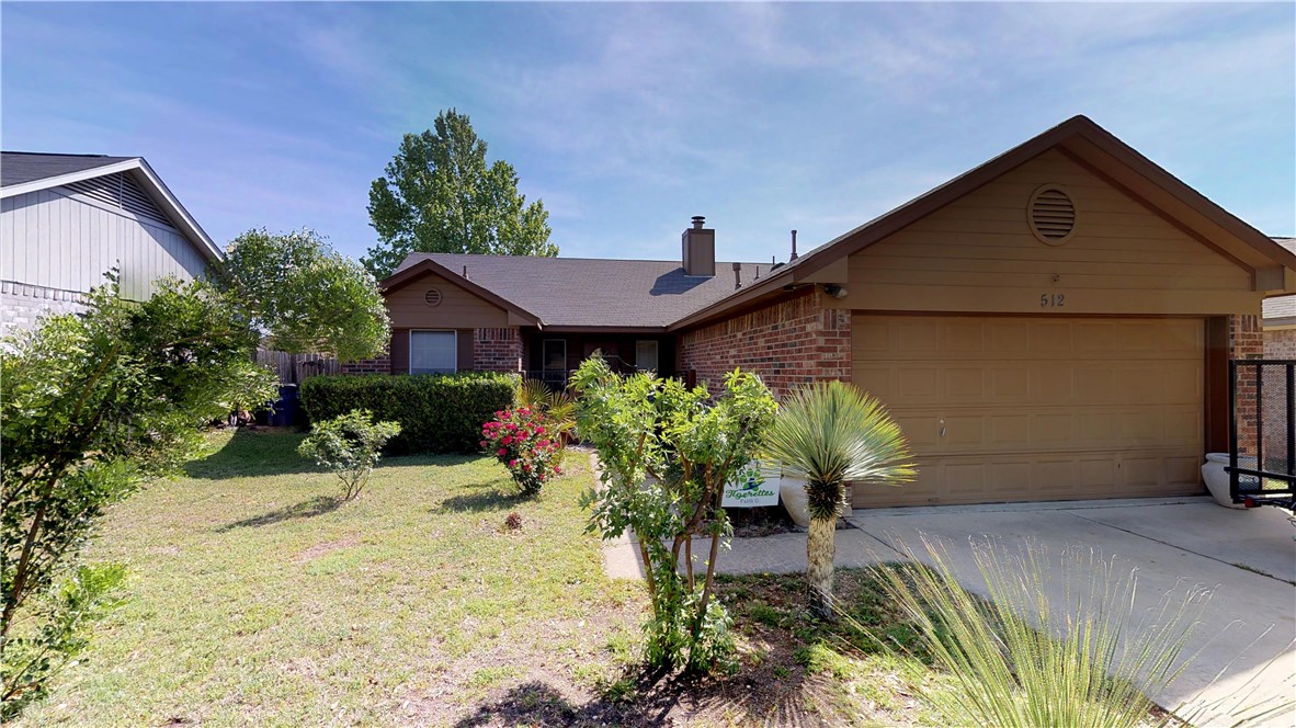 512 Maplecreek Drive Leander, TX 78641 - Photo 1 of 1 a front view of a house with a yard