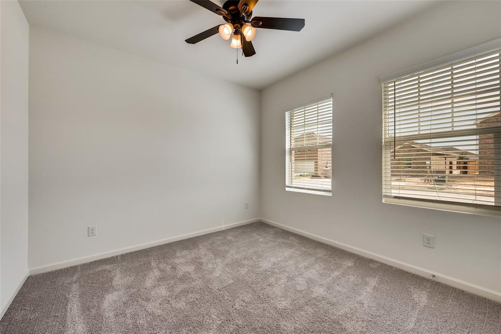 1608 Escondido Drive Haslet, TX 76052 - Photo 14 of 20 a view of a livingroom with a ceiling fan and window